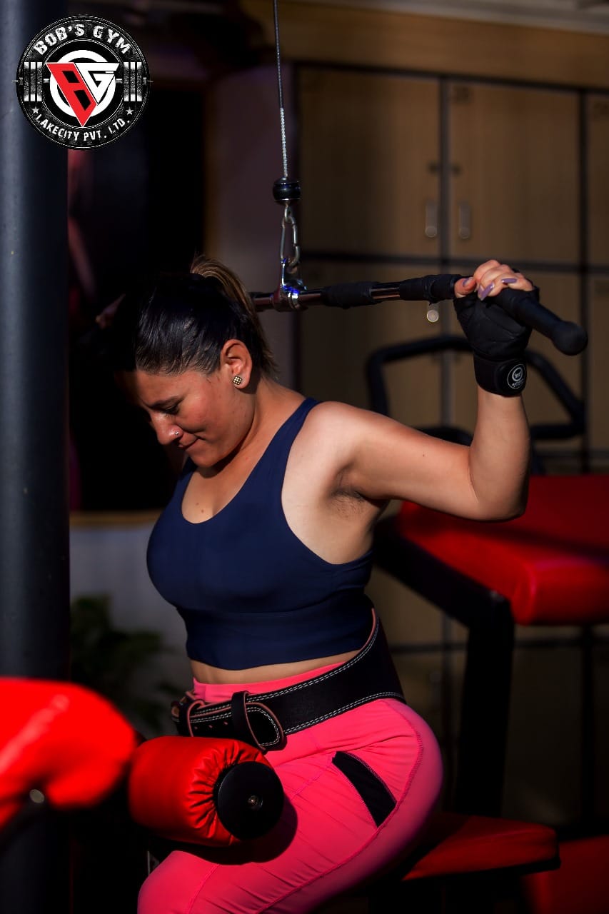 A member performing a resistance machine exercise