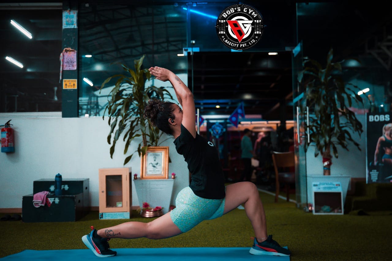 A member practising a yoga pose at BobsGym